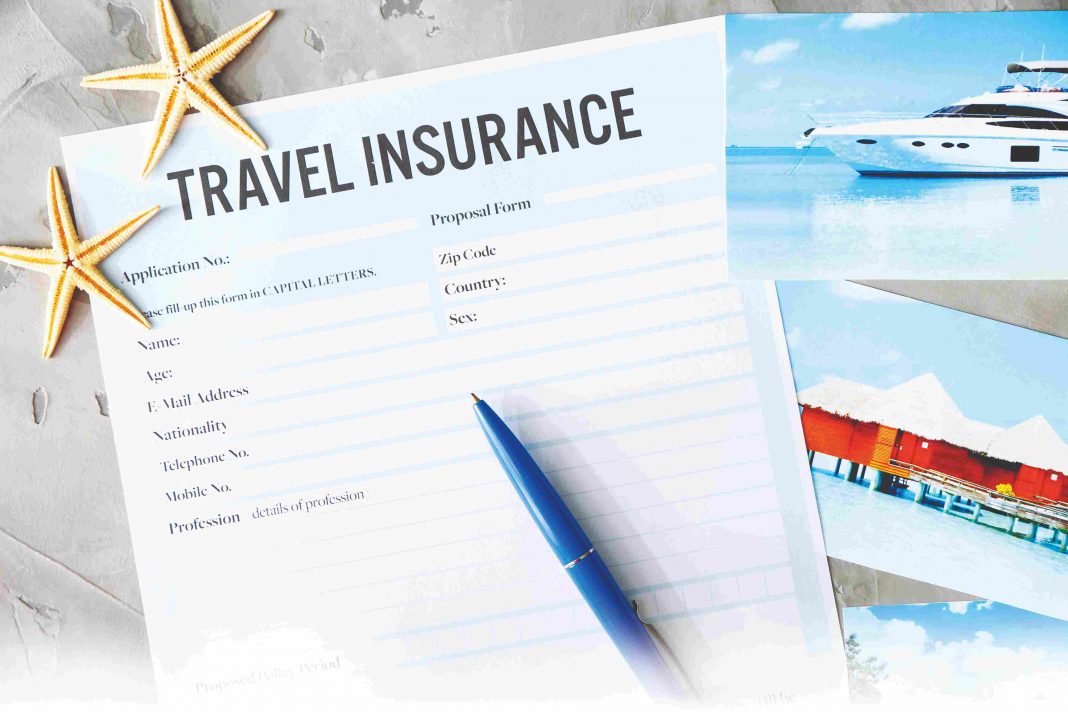 Pen on a paper, the paper is form for travel insurance, there two decorative star fishes on the paper and there is a image of cruises behind the paper.
